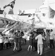 Passengers dancing on deck onboard ORCADES