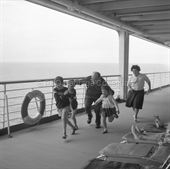 Children playing on CANBERRA's deck